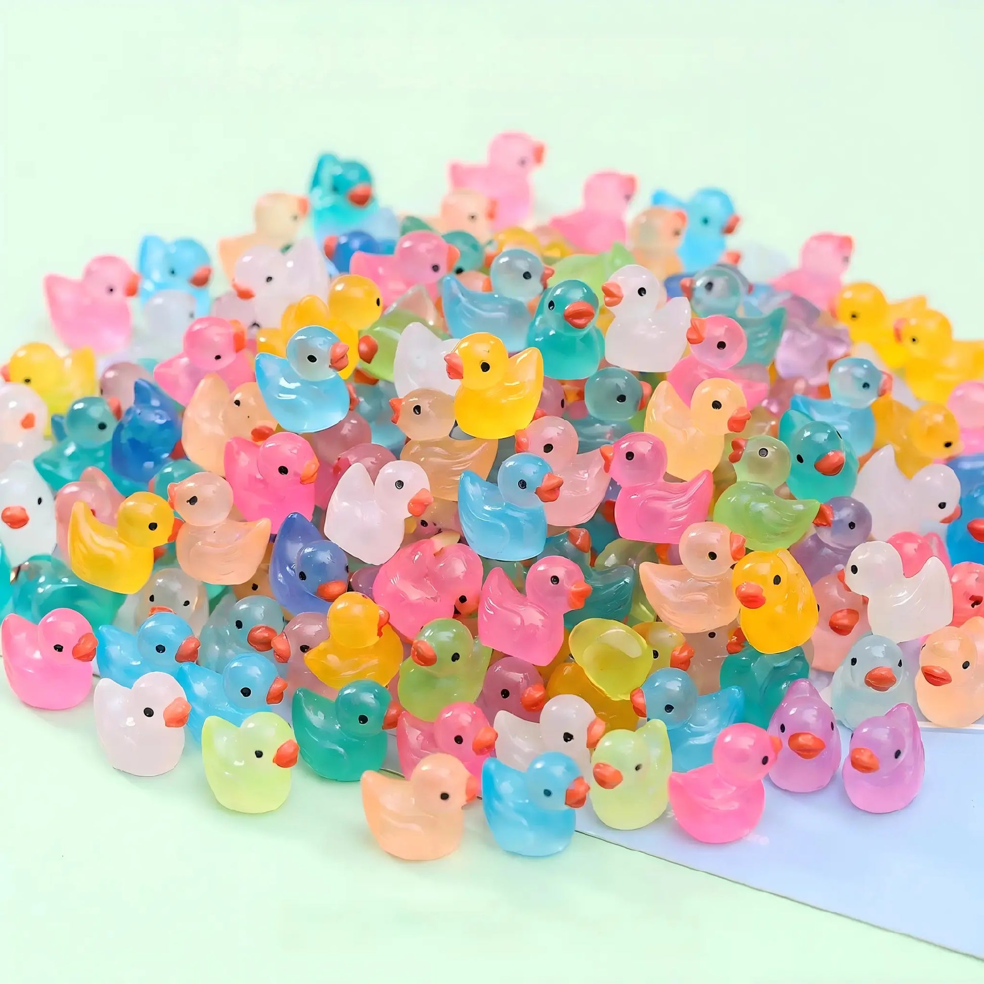 Assorted colorful glow-in-the-dark jelly duck miniatures