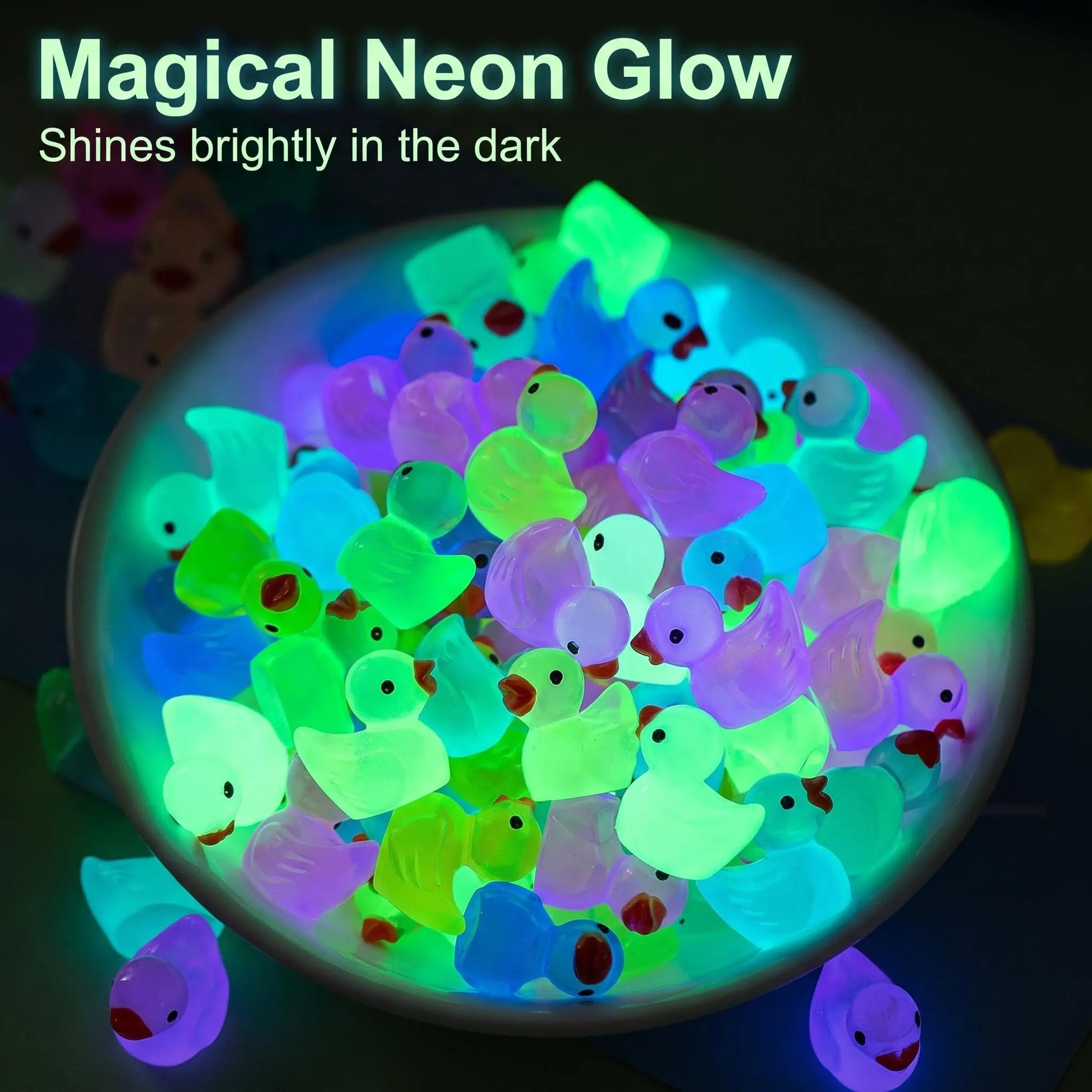 Mini jelly ducks glowing in neon colors at night